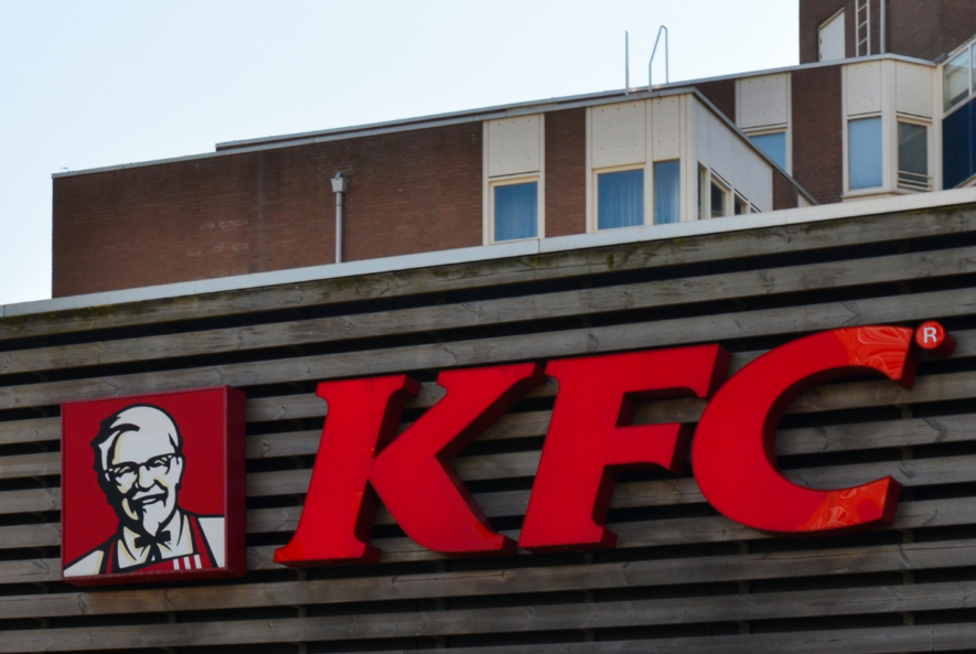 professional-plumber-installing-drainage-system-in-kfc-fast-food-restaurant-kitchen