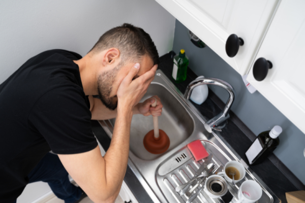drain-camera-inspection-specialist-examining-pipe-blockage